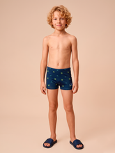 Laad de afbeelding in de Gallery-viewer, Model Front: Uv Line Boy's Swimwear Swim Trunks Kids Pirates Fun Upf50+